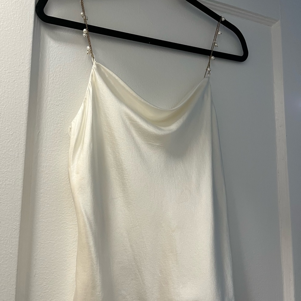 “Busy Cami” in white from CAMI. Only worn once to a bridal event- like new.